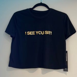 Never worn black graphic tee crop top. Tag is still on the top.